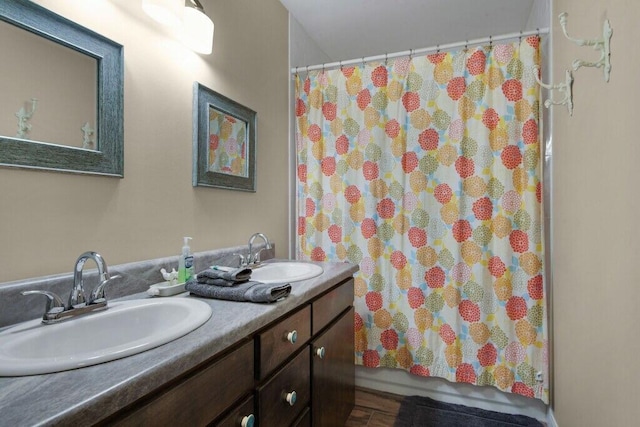 bathroom featuring vanity and shower / tub combo with curtain