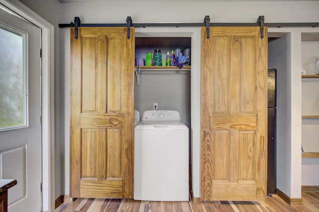 laundry area featuring hardwood / wood-style floors