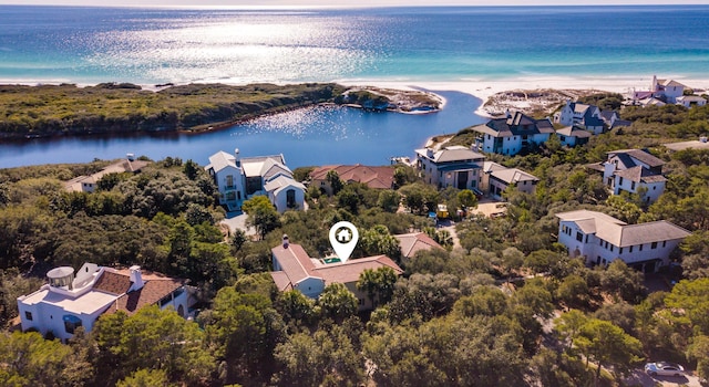 aerial view with a water view, a residential view, and a beach view