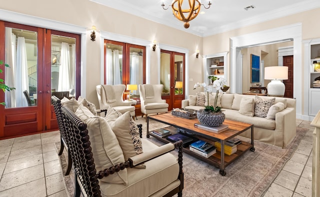 living area with a chandelier, visible vents, ornamental molding, french doors, and stone tile flooring