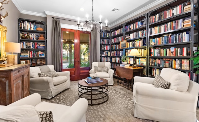 sitting room with crown molding, visible vents, french doors, wall of books, and an inviting chandelier