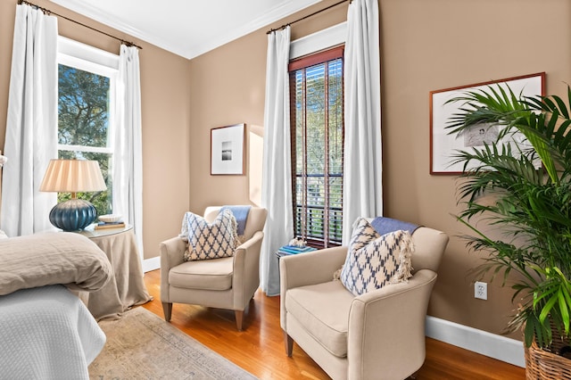 sitting room with wood finished floors and baseboards