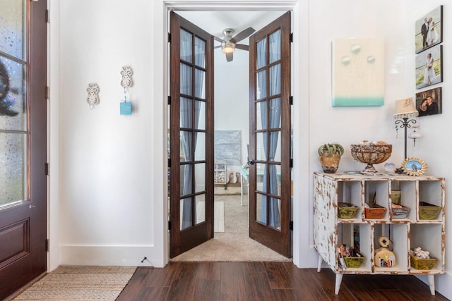 foyer with french doors, dark hardwood / wood-style flooring, and ceiling fan