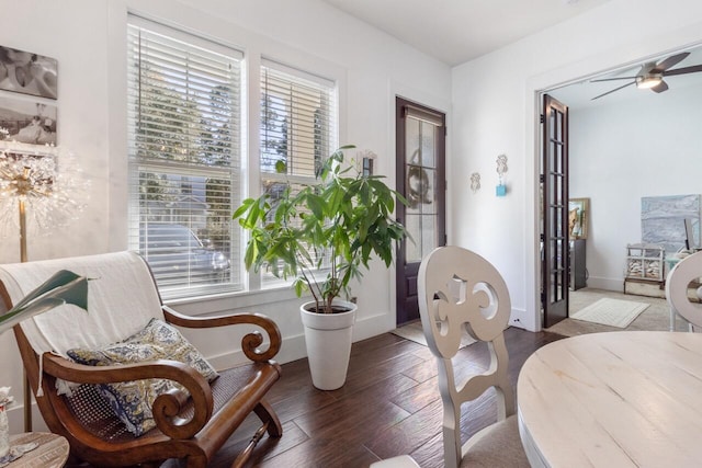 sitting room featuring ceiling fan, dark hardwood / wood-style flooring, and french doors