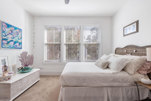 bedroom with ceiling fan and carpet