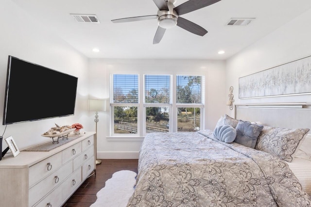 bedroom featuring ceiling fan and dark wood-type flooring