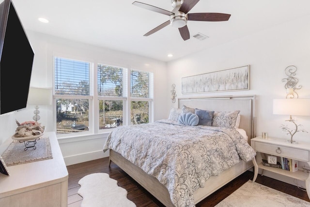 bedroom featuring ceiling fan and dark hardwood / wood-style floors