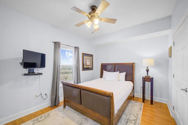 bedroom featuring light wood-type flooring and ceiling fan