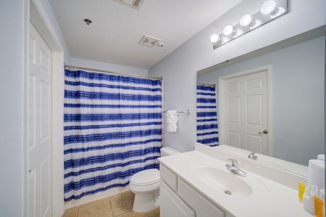 bathroom with curtained shower, tile patterned flooring, vanity, and toilet