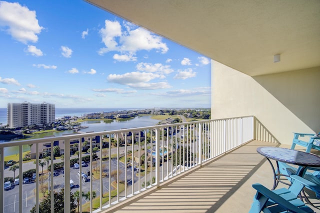 balcony featuring a water view