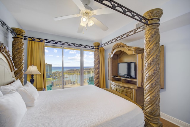 bedroom featuring hardwood / wood-style flooring, ceiling fan, and access to outside