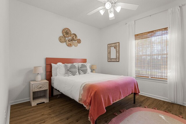 bedroom featuring dark hardwood / wood-style flooring and ceiling fan