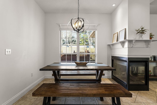 tiled dining area with a multi sided fireplace and an inviting chandelier