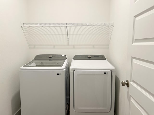 laundry area featuring laundry area and separate washer and dryer