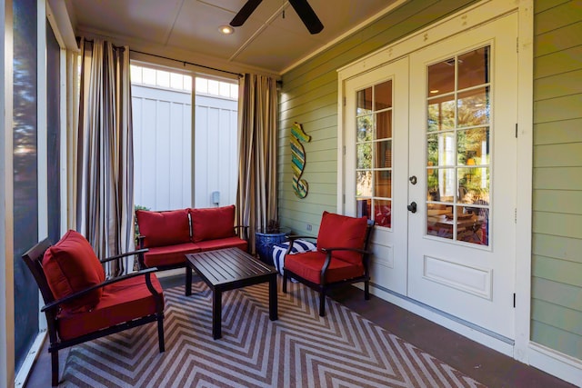 sunroom with french doors, a wealth of natural light, and ceiling fan