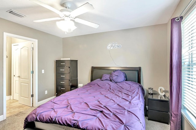 bedroom featuring ceiling fan and light colored carpet