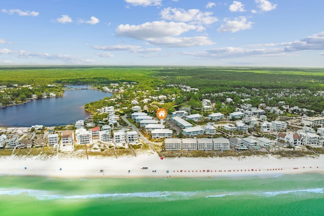 aerial view with a water view and a beach view