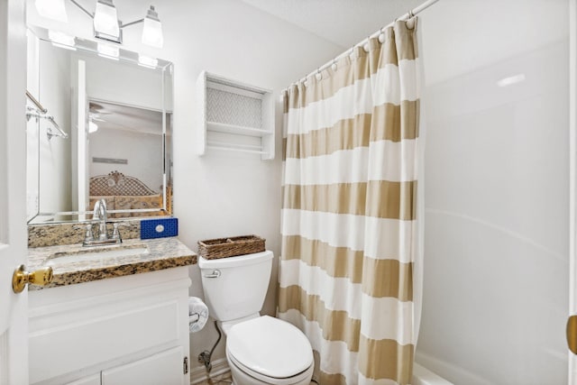 full bathroom featuring vanity, shower / tub combo, and toilet