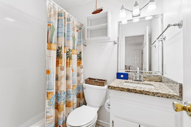 full bathroom with vanity, shower / tub combo, and toilet