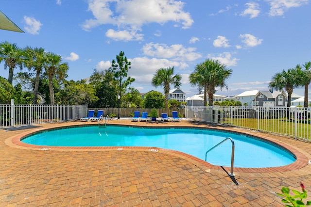 view of swimming pool with a patio area