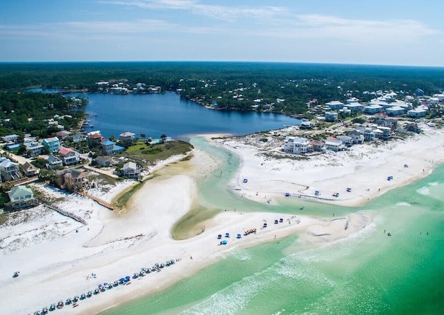 bird's eye view with a water view and a view of the beach