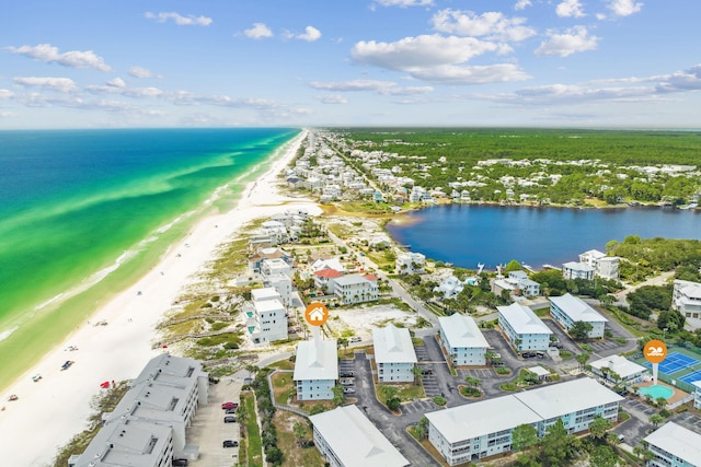 aerial view with a water view and a beach view