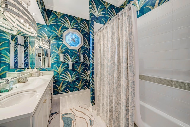 bathroom featuring vanity, ornamental molding, and shower / bath combo