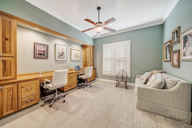 home office with ceiling fan, light colored carpet, and ornamental molding