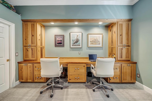 carpeted home office with ornamental molding