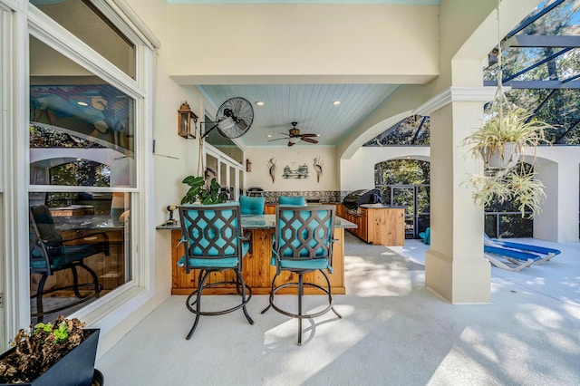 view of patio with grilling area and ceiling fan