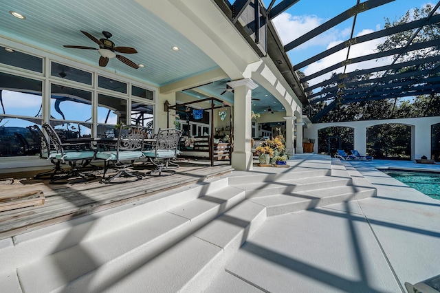 exterior space featuring ceiling fan