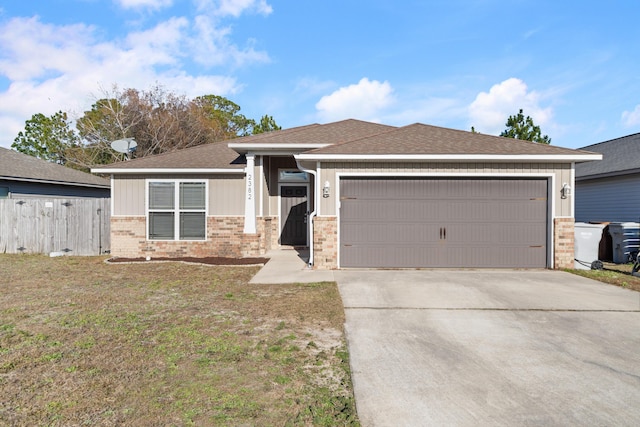 view of front of property with a garage and a front lawn