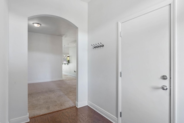 hall with dark hardwood / wood-style floors