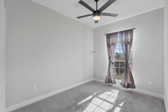 spare room with ceiling fan and carpet floors