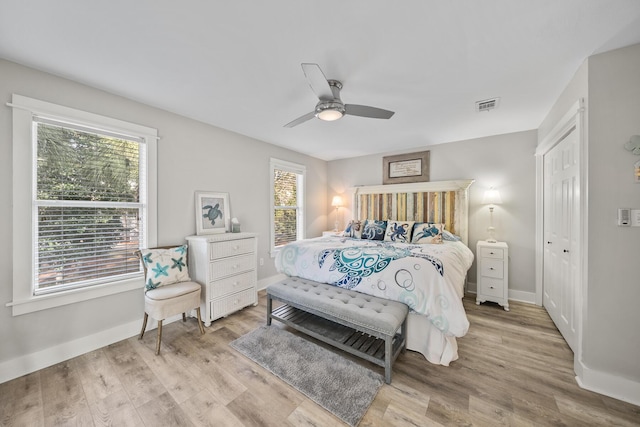 bedroom featuring a closet, ceiling fan, and light hardwood / wood-style floors