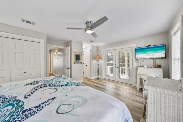 bedroom with ceiling fan, french doors, light hardwood / wood-style floors, access to outside, and a closet