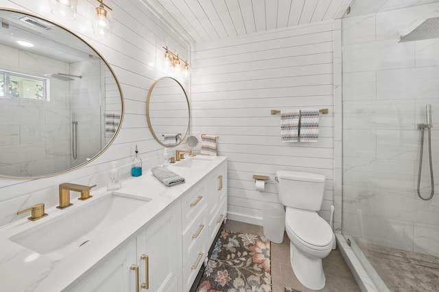 bathroom featuring vanity, toilet, walk in shower, and wooden walls