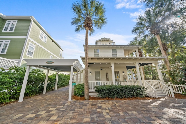 exterior space with a porch and a carport