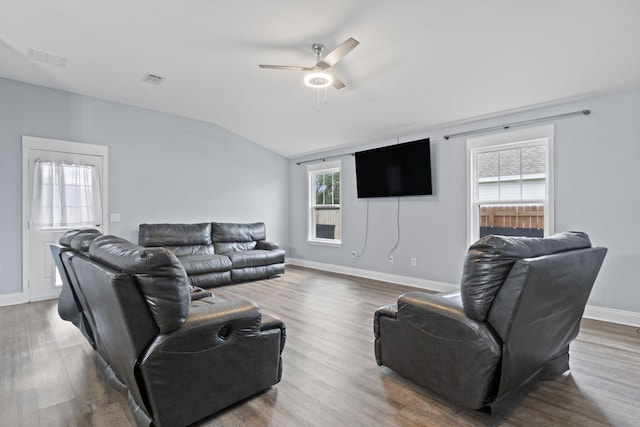 living room with wood-type flooring, vaulted ceiling, and ceiling fan