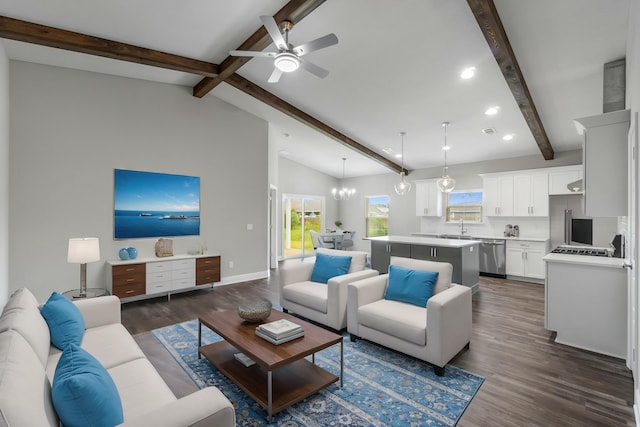 living room with sink, ceiling fan with notable chandelier, lofted ceiling with beams, and dark hardwood / wood-style floors