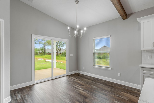 unfurnished dining area featuring lofted ceiling with beams, dark hardwood / wood-style floors, and a chandelier