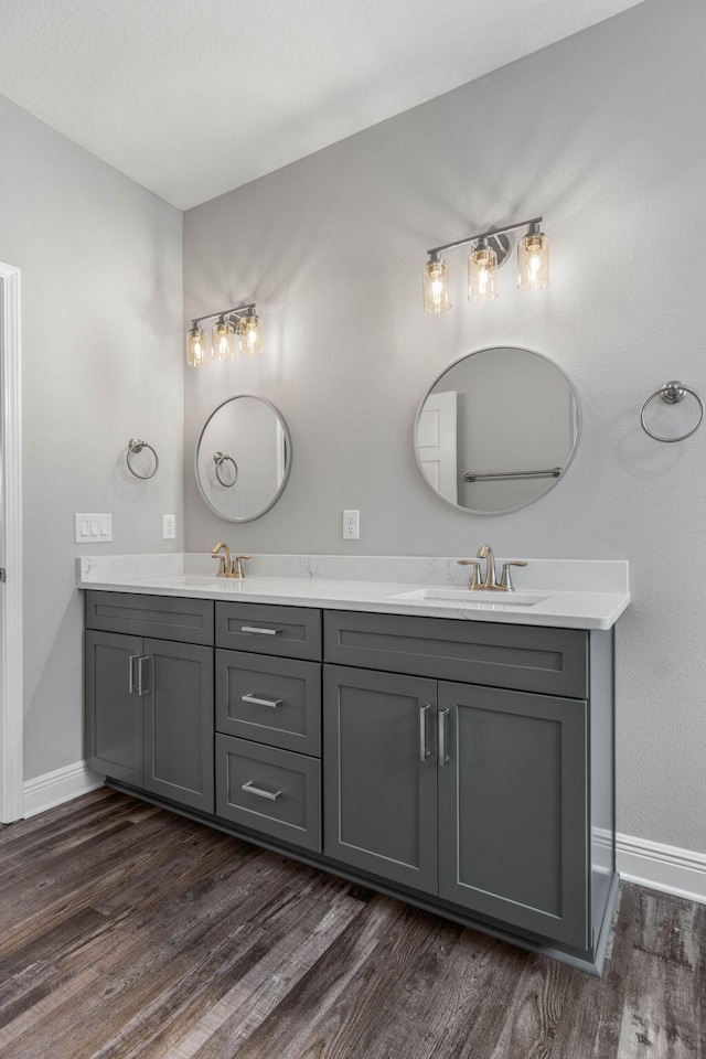 bathroom with vanity and hardwood / wood-style floors