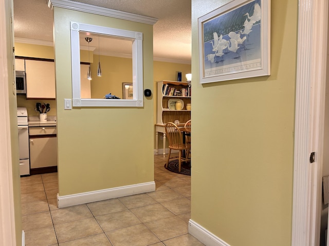 hallway featuring crown molding, light tile patterned floors, and a textured ceiling