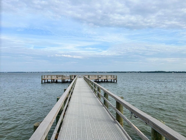 dock area featuring a water view