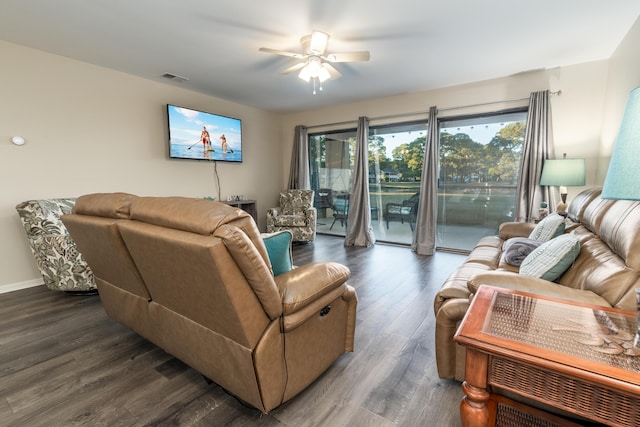 living room with ceiling fan and dark hardwood / wood-style floors