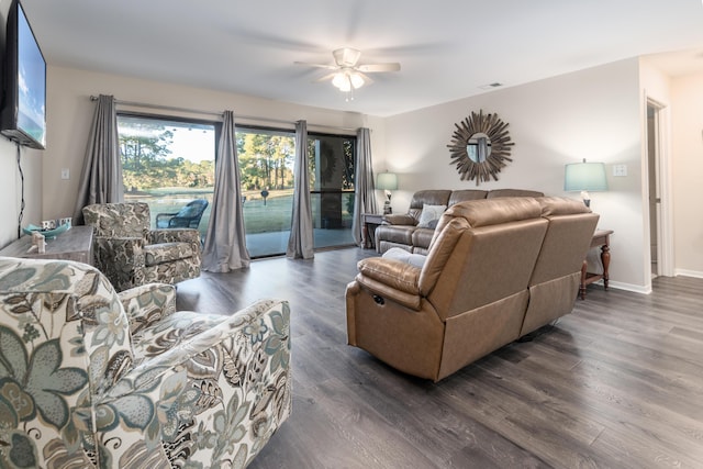 living room with dark hardwood / wood-style floors and ceiling fan