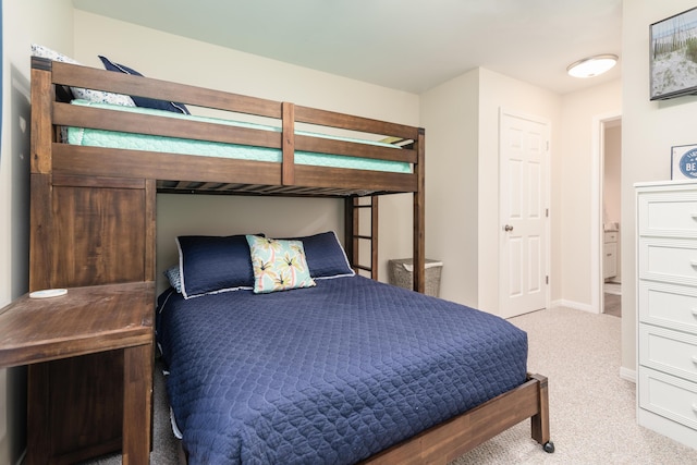 bedroom featuring light colored carpet