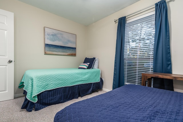 bedroom with light carpet