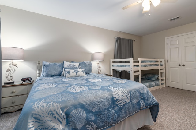 carpeted bedroom with a closet and ceiling fan