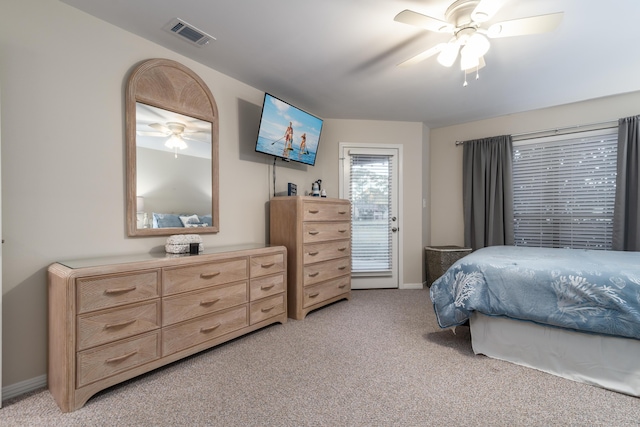 bedroom featuring ceiling fan and light carpet